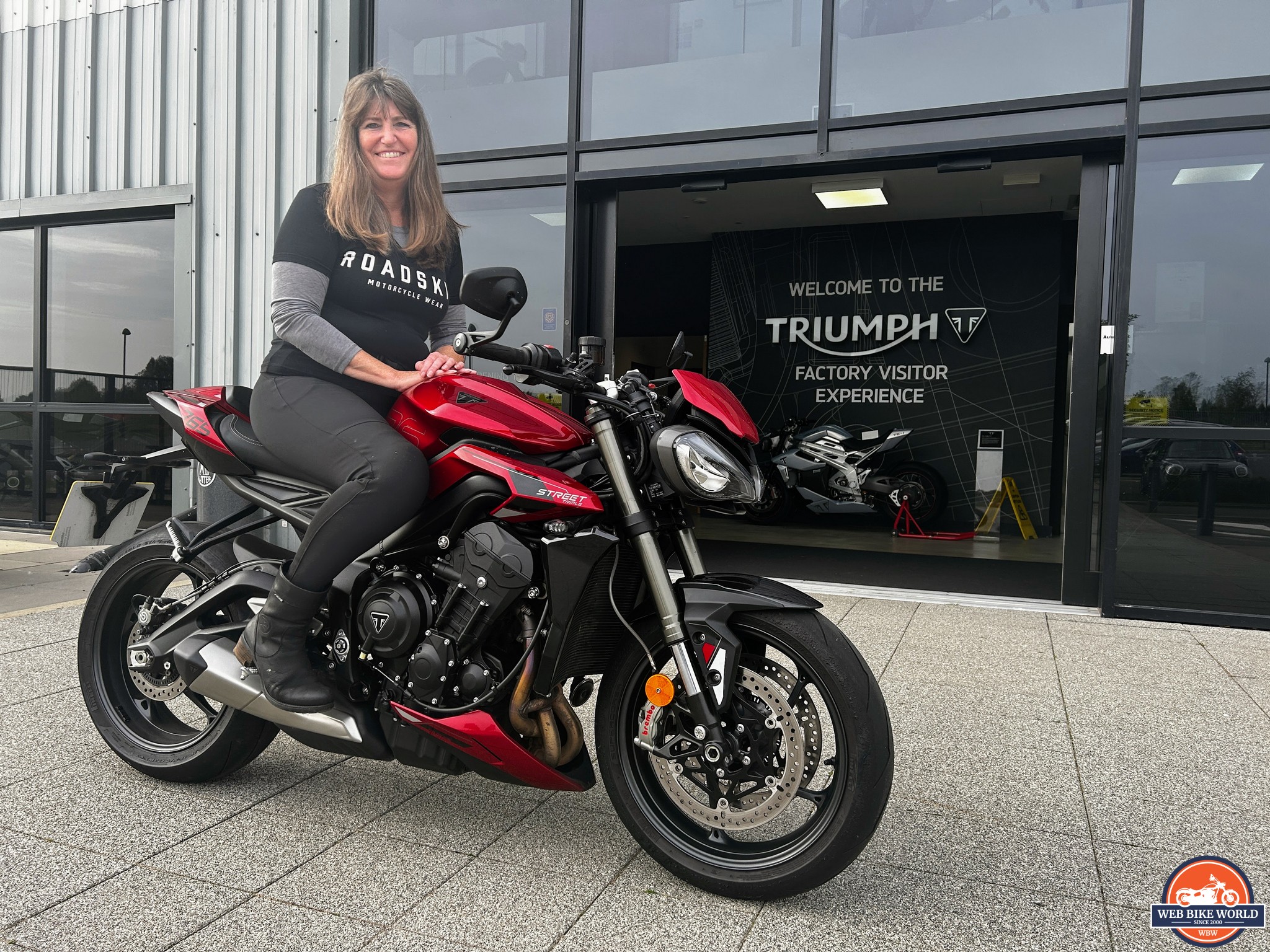 BikerKaz sitting on the 2023 Triumph Street Triple 765RS outside Triumph dealership