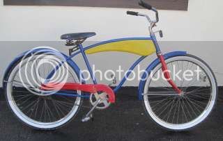 23087867_1986-huffy-mad-man-bicycle-bike-blue-red-wyellow-tank-_zps0zpqi44e.jpg