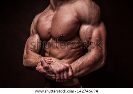 stock-photo-muscled-male-model-showing-his-hand-142746694.jpg