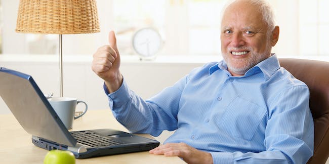 old-man-gives-thumbs-up-with-laptop.jpeg