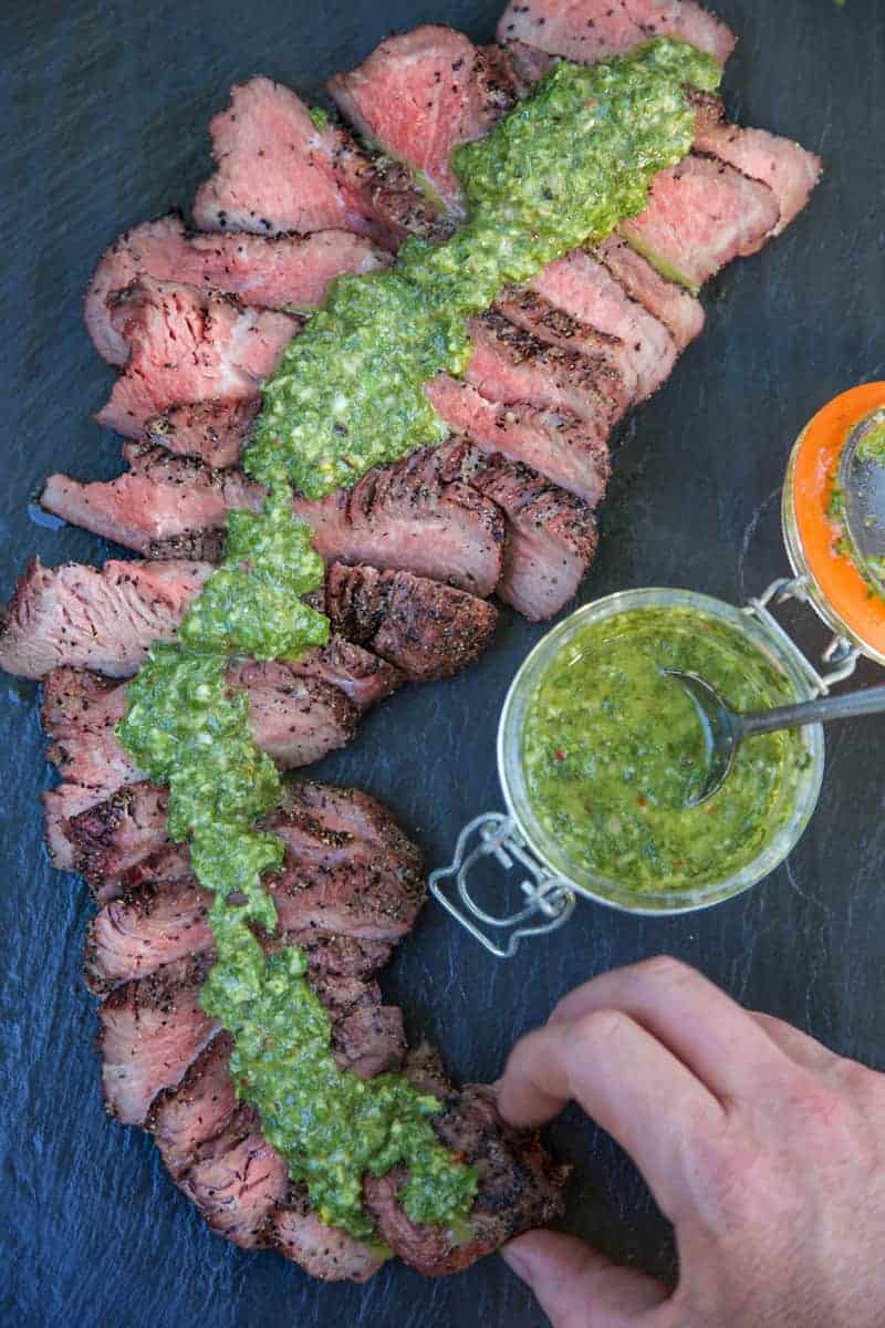 Smoked-Tri-Tip-with-Chimichurri-Sauce-digging-in.jpg