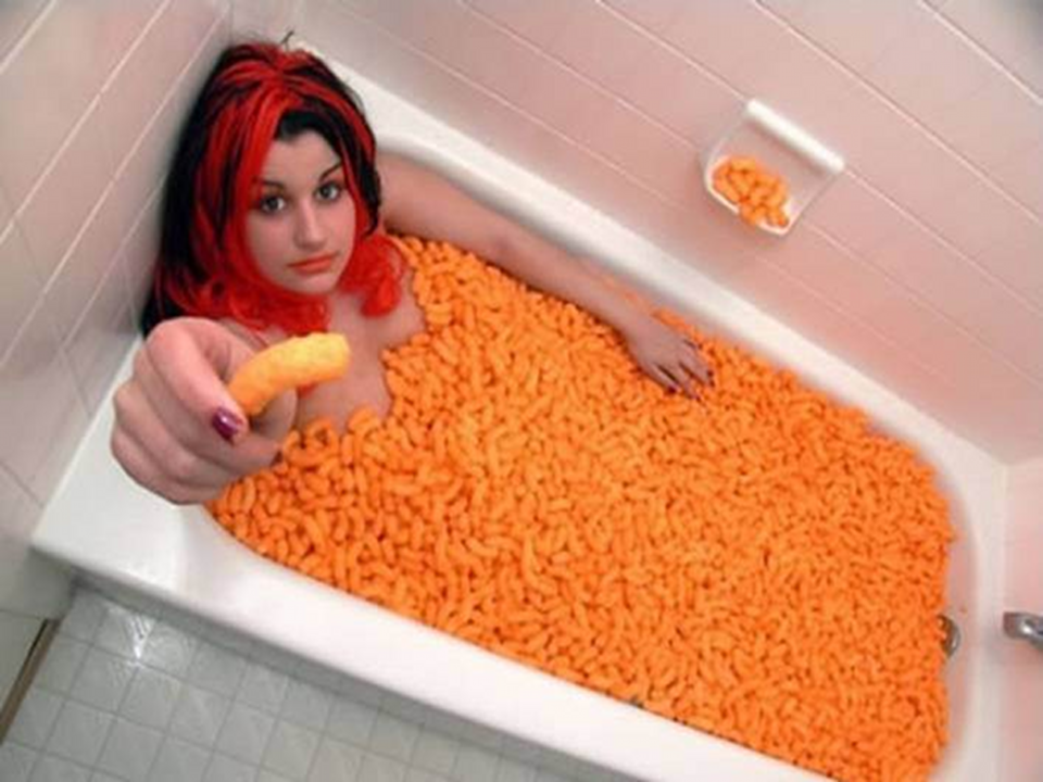GirlInTubWithCheesePuffs.png