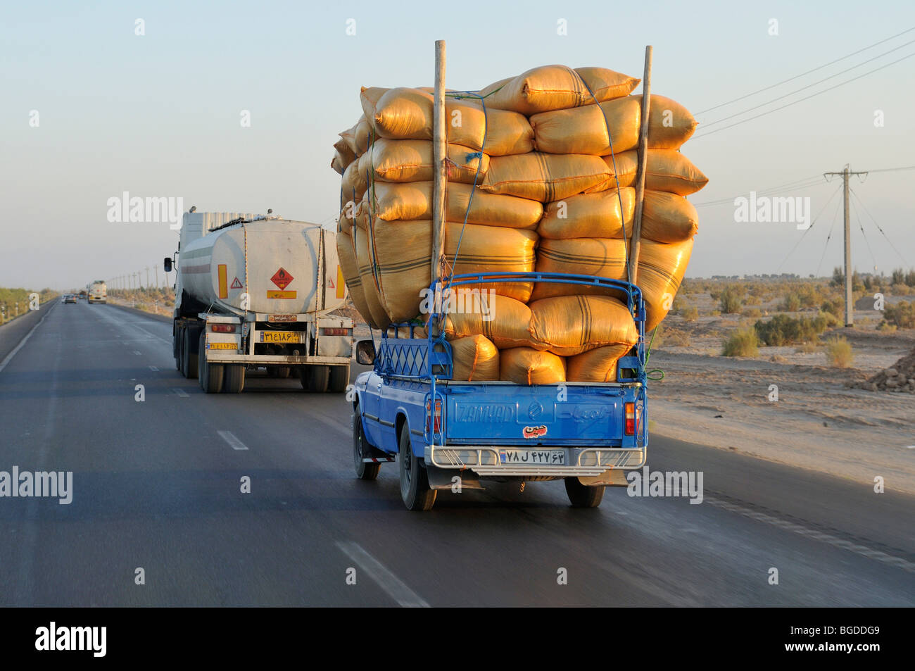 iranian-pickup-truck-overloaded-with-sacks-on-a-highway-iran-persia-BGDDG9.jpg