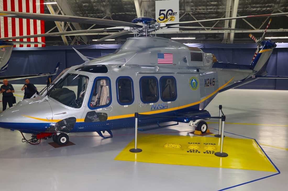 A NEST AgustaWestland 139 helicopter equipped with special radiation monitoring equipment on display during the team's 50th anniversary celebration at Joint Base Andrews. The helicopters, which measure radiation by flying low and slowly, are deliberately painted with a civilian color scheme to avoid the 