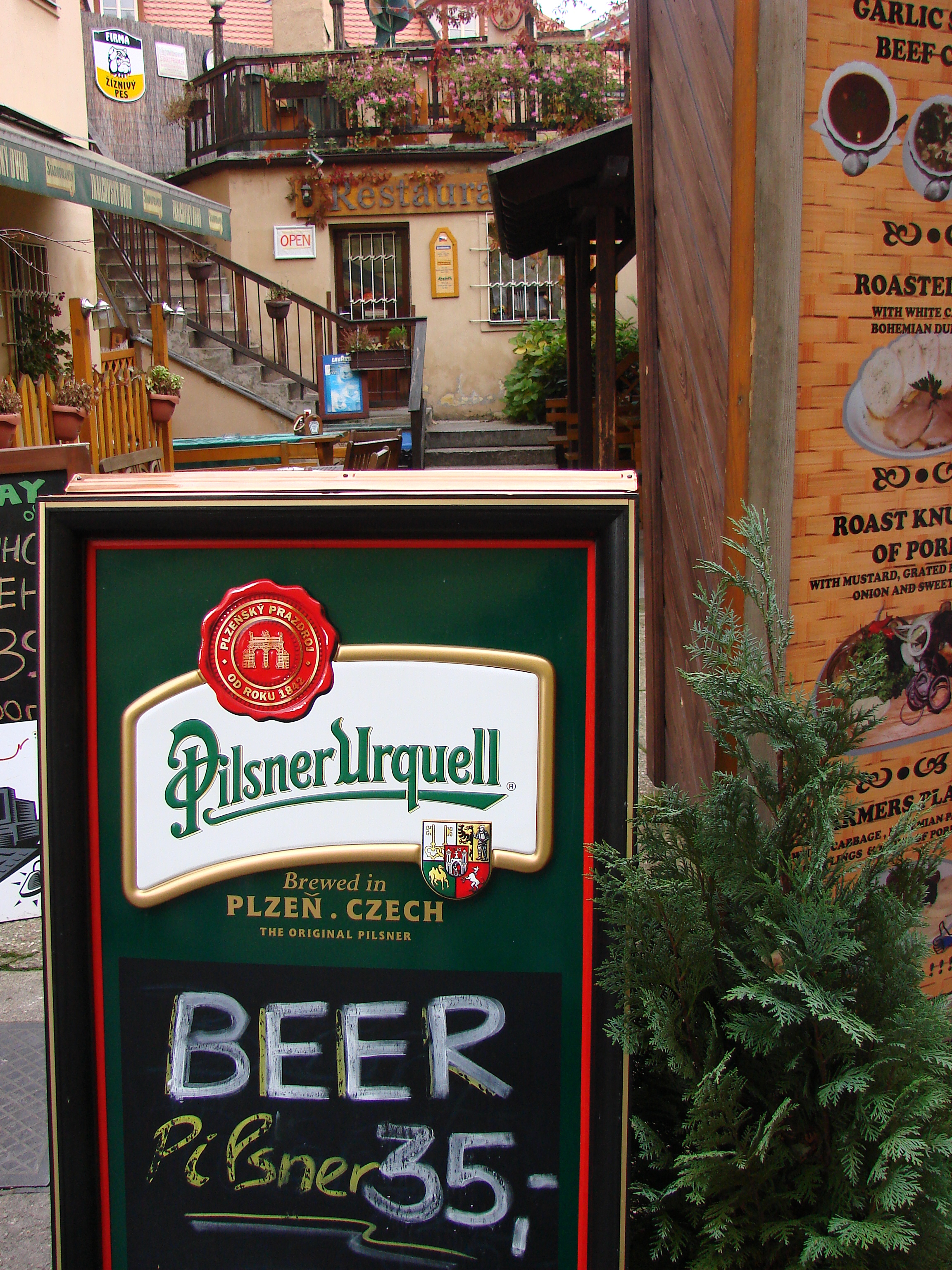 Cafe_with_Pilsner_Urquell_Beer_Sign_-_Prague_-_Czech_Republic.jpg