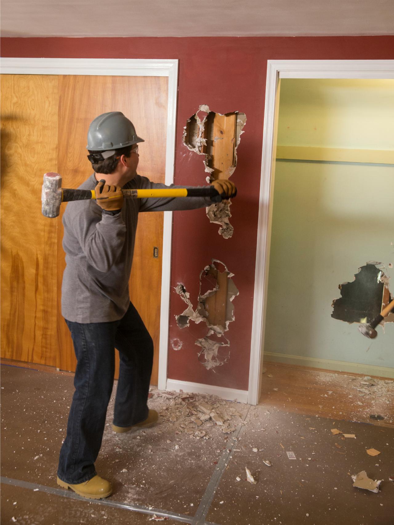 BP_DSLH105H_Sledgehammer-smashing-wall-bedroom-during_v.jpg.rend.hgtvcom.1280.1707.jpeg