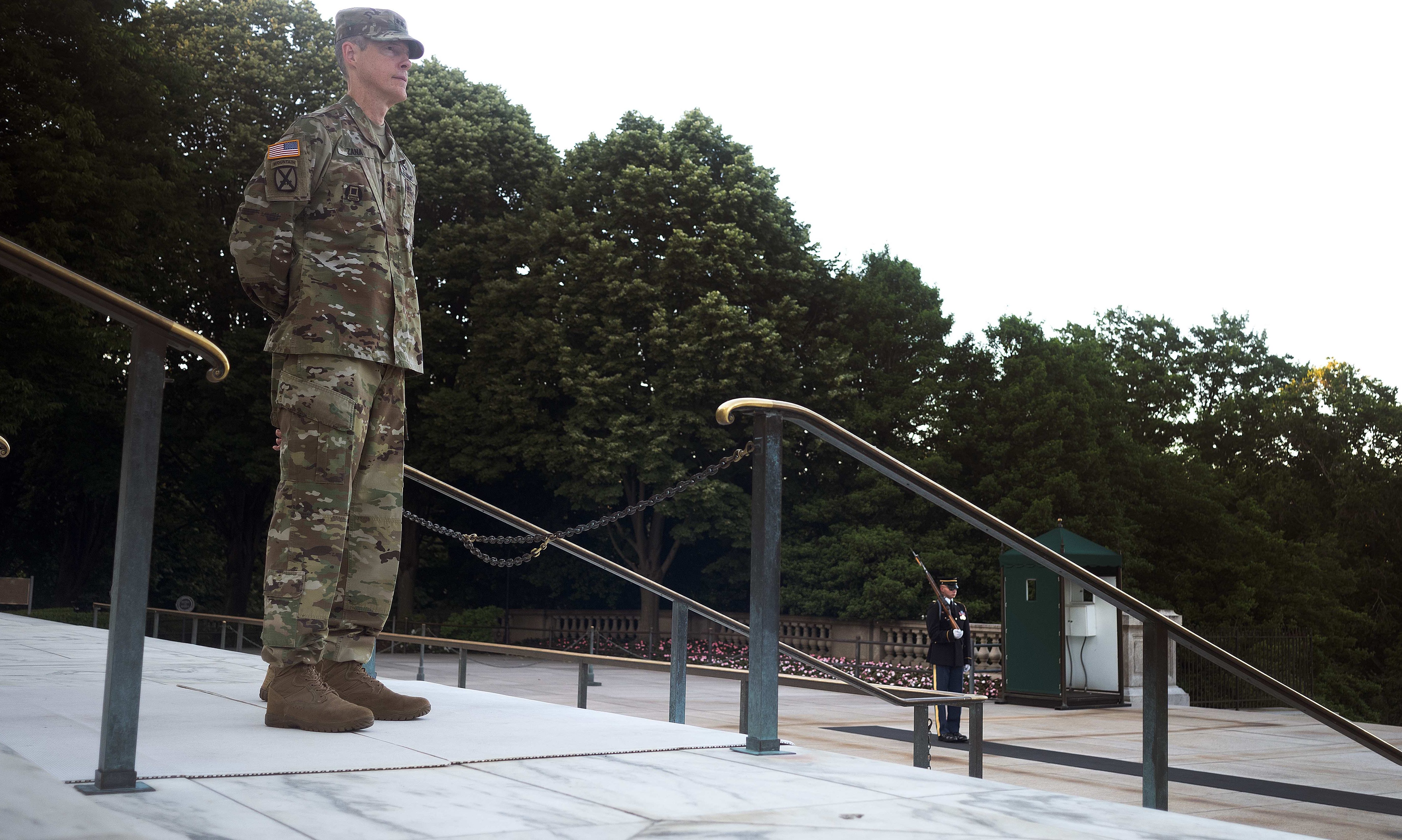 U.S. Army Maj. Gen. William Zana, director of international affairs with the National Guard Bureau, watches the changing of the guard at the Tomb of the Unknown Soldier at Arlington National Cemetery, May 31, 2024. Zana, who served as a Tomb guard early in his career, stood watch at the Tomb as his final act in uniform. Just after completing his watch, at midnight, June 1, Zana would officially be retired from the Army. (U.S. Army photo by Sgt. 1st Class Jon Soucy)