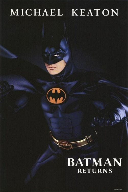 1992-batman-returns--major-changes-in-the-sequel-include-the-bat-emblem-and-design-of-the-suit-batmans-chest-and-abs-look-less-natural.jpg