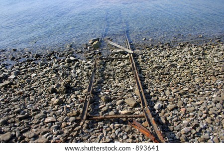 stock-photo-old-rusty-rails-going-into-the-water-893641.jpg