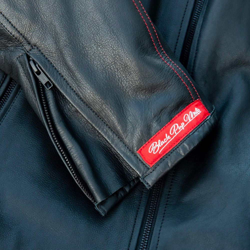 Black Pup Moto's new Rumbler Jacket on a rider - detail shot of label