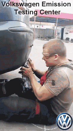 volkswagen-emission-testing-center-passed-animation-guy-hit-in-the-face-black-smoke.gif