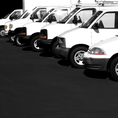 28040372-several-cars-vans-and-trucks-parked-in-parking-lot-for-sale.jpg