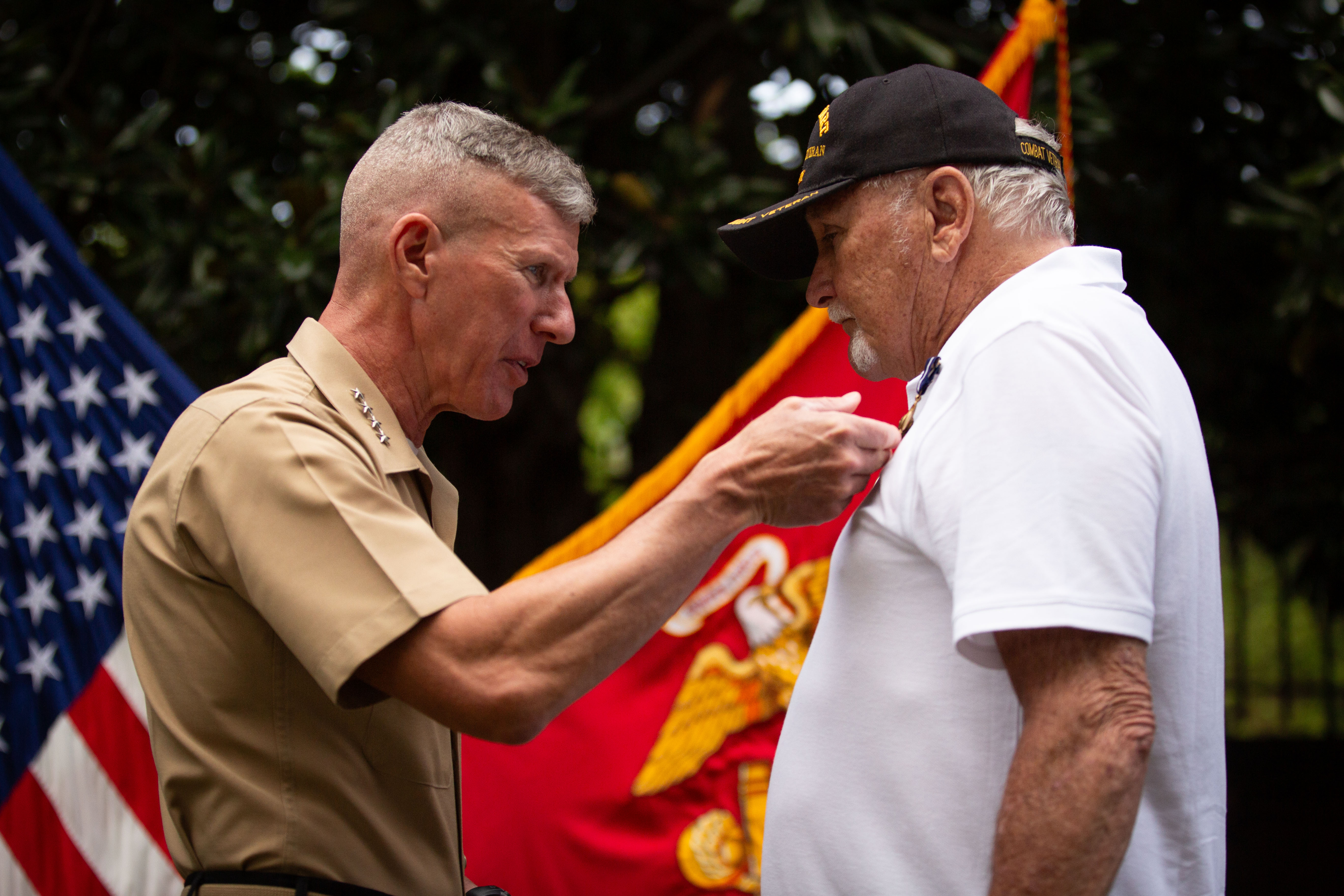 The 39th Commandant of the Marine Corps, Gen. Eric M. Smith, pins Cpl. Daniel L. Heller, a U.S. Marine Corps Vietnam veteran, during his Navy Cross award ceremony at Marine Barracks Washington, Washington D.C., Wednesday, Aug. 28, 2024. The award ceremony was an upgrade to a Navy Achievement Medal (with Valor device) for Cpl. Heller's actions during the Vietnam War on Feb. 13, 1969.