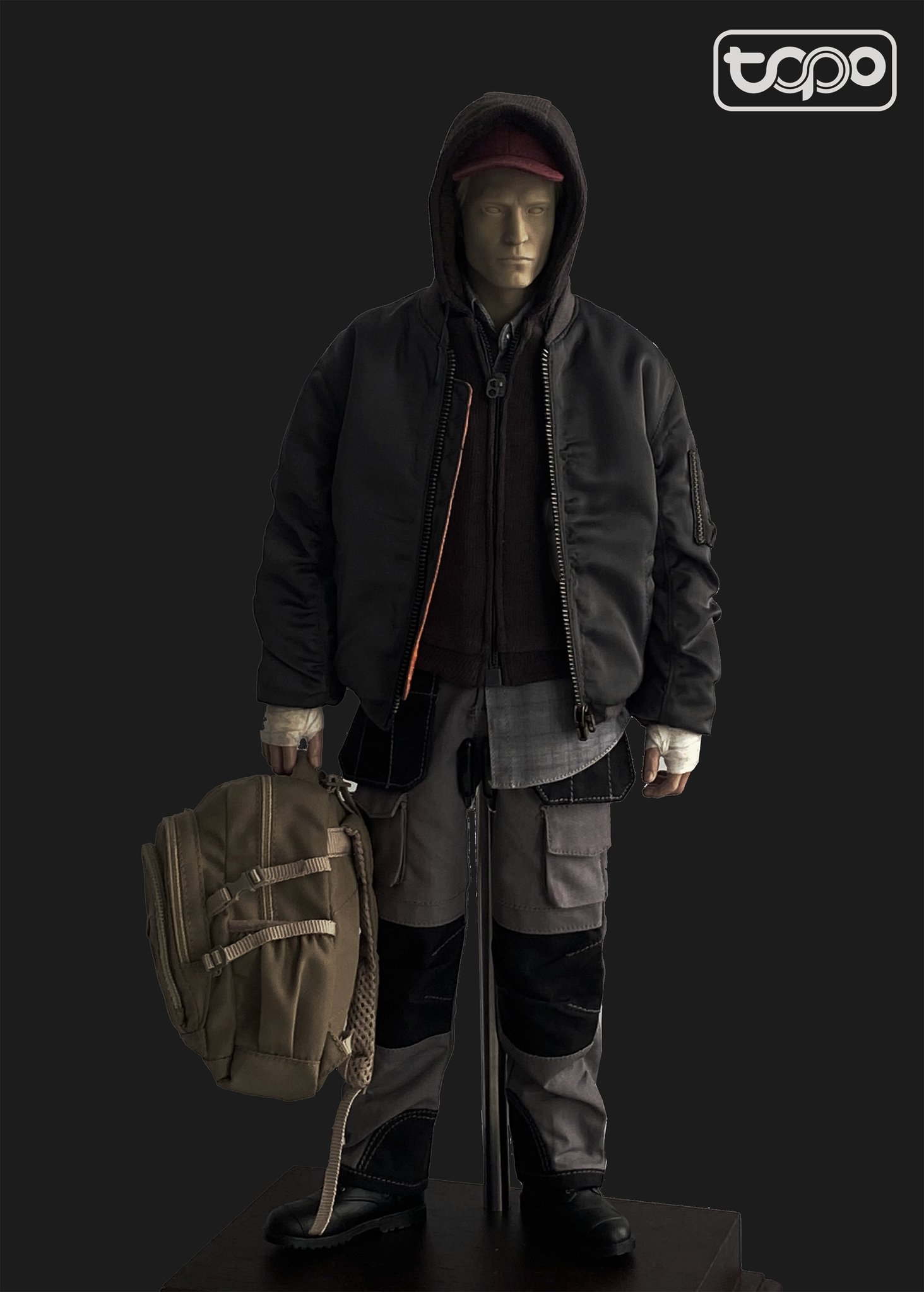 May be an image of 1 person, tool bag, overcoat, goose-down coat, duffel coat and text