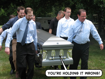 jobs-funeral-holding-wrong.jpg