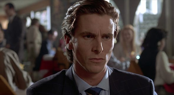christian-bales-patrick-bateman-in-american-psycho-2000-is-the-yuppie-wall-street-businessman-egotistical-materialistic-selfish-and-competitive-over-business-cards-bonus-hes-a-serial-killer-too.jpg