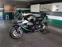 Q J Motor superbike motorcycle parked in garage left side profile