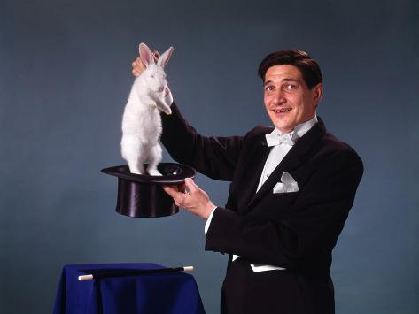 1960s-1970s-man-magician-tuxedo-pulling-rabbit-out-of-top-hat-magic-illusion-sleight-of-hand-trick.jpg