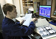 220px-US_Navy_110129-N-7676W-152_Culinary_Specialist_3rd_Class_John_Smith_uses_the_existing_DOS-based_food_service_management_system_aboard_the_aircraft.jpg