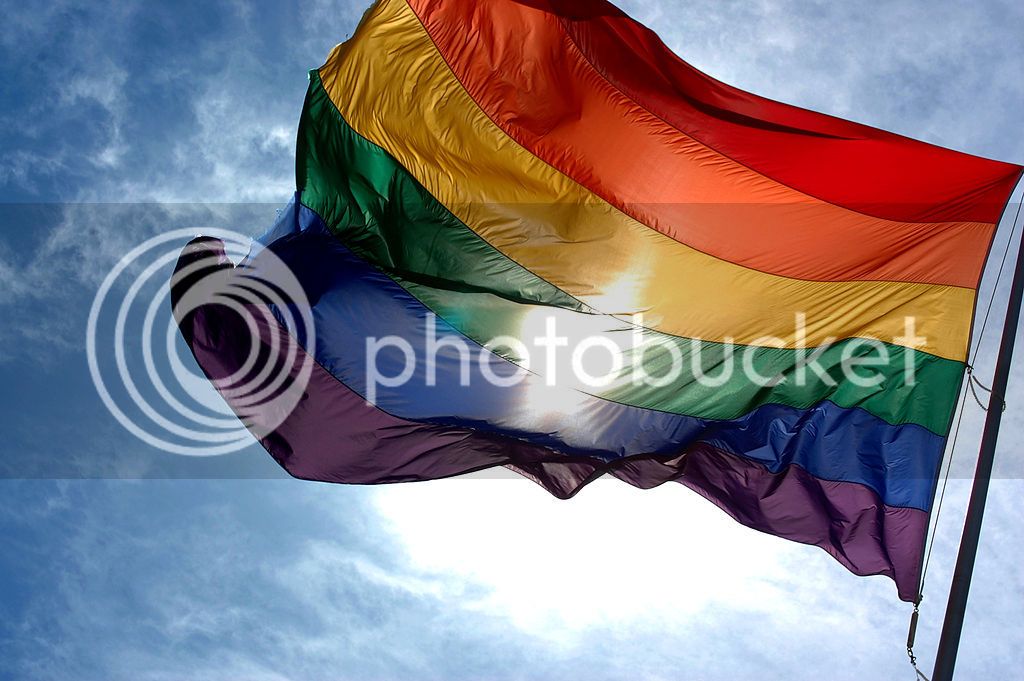 1024px-Rainbow_flag_and_blue_skies.jpg