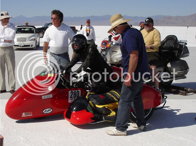 German20sidecar20team20at20the20bonneville20salt20flats20note20the20position20of20the20female20sidecar20passengers20head.jpg