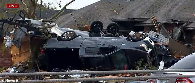 In the same area, a pickup truck was seen flipped into someone's yard