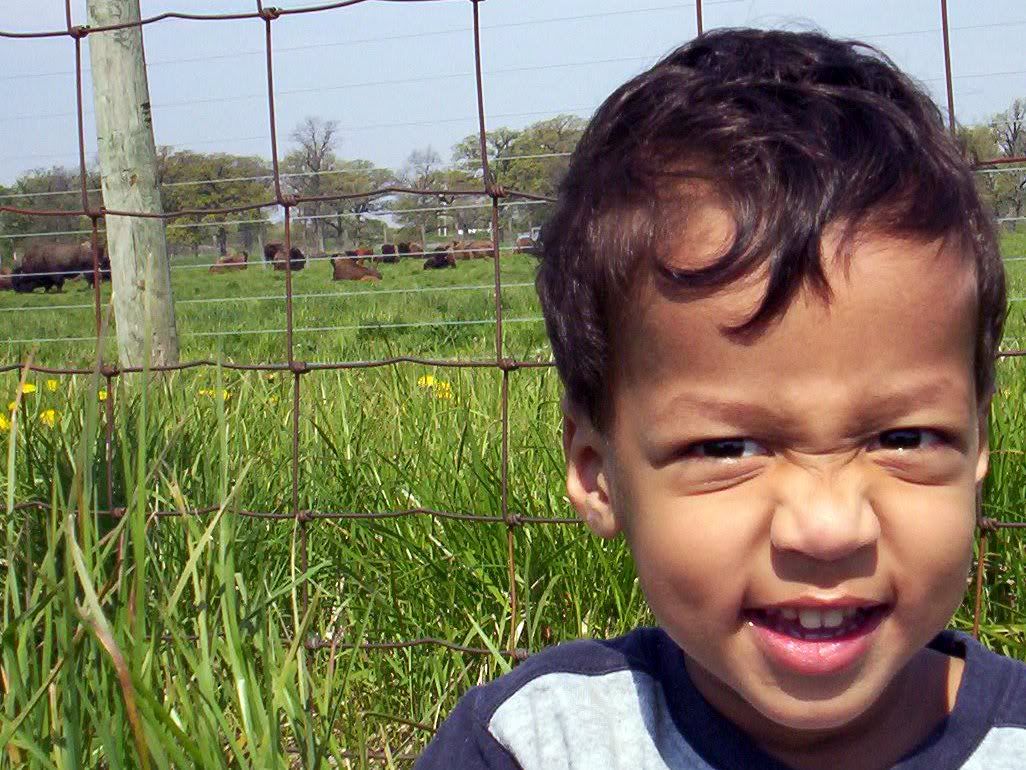 Ishaq_smiles_with_buffalos.jpg