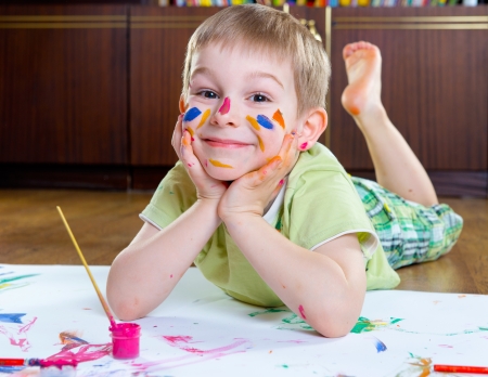 19203441-excited-little-boy-painting-with-colorful-paints.jpg