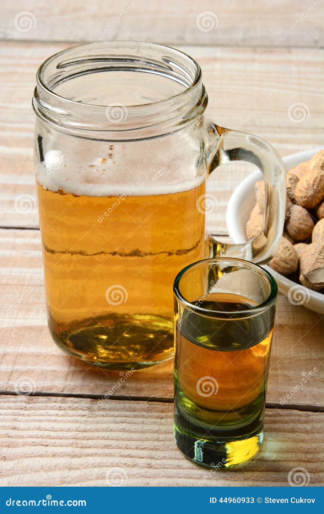 shot-beer-closeup-whiskey-mug-bowl-peanuts-vertical-format-rustic-wood-table-44960933.jpg