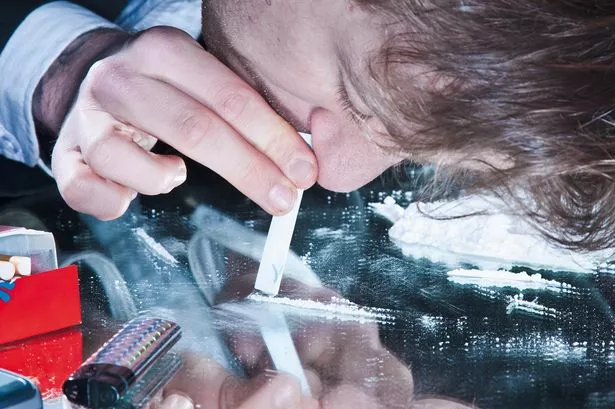 Young-man-sniffing-cocaine.jpg