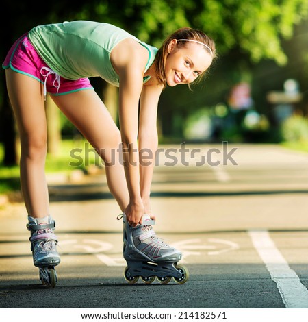 stock-photo-rollerblading-woman-young-attractive-female-fitness-model-is-having-fun-skating-in-a-city-park-in-214182571.jpg