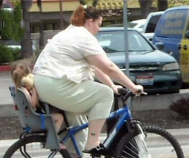 large-woman-on-bike-with-baby.jpg