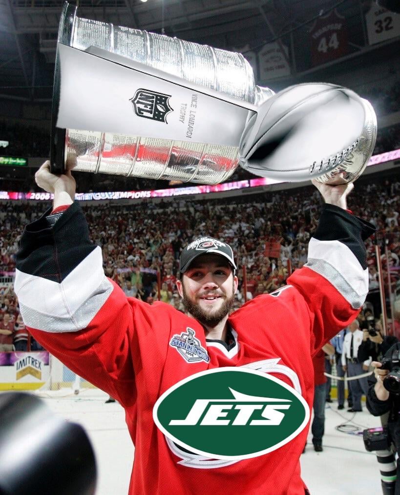 cam-ward-hoisting-the-lombardi-in-a-jets-uniform-v0-pkrhjyxr1cme1.jpeg