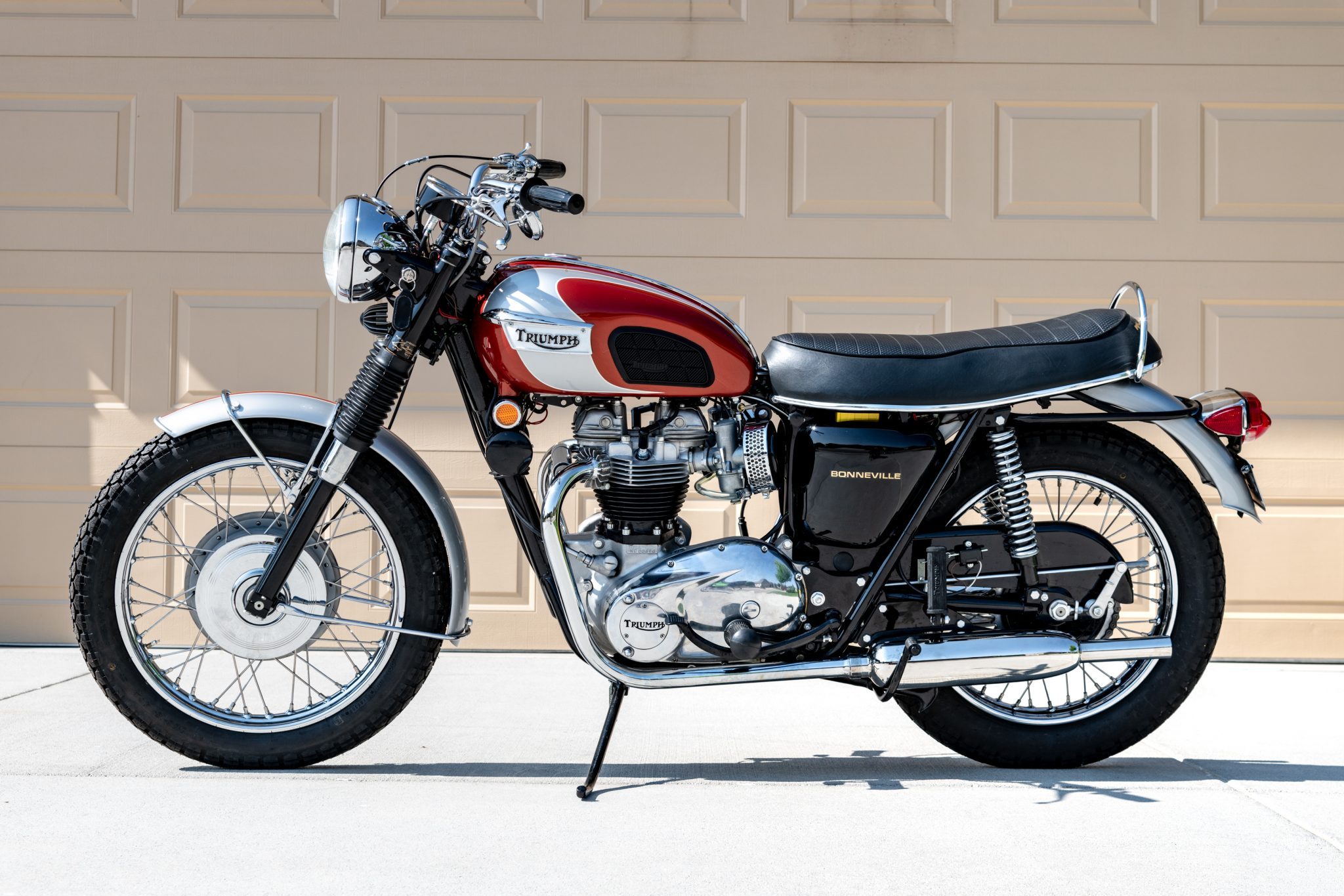 a classic 1969 Triumph Bonneville T120R parked on a driveway