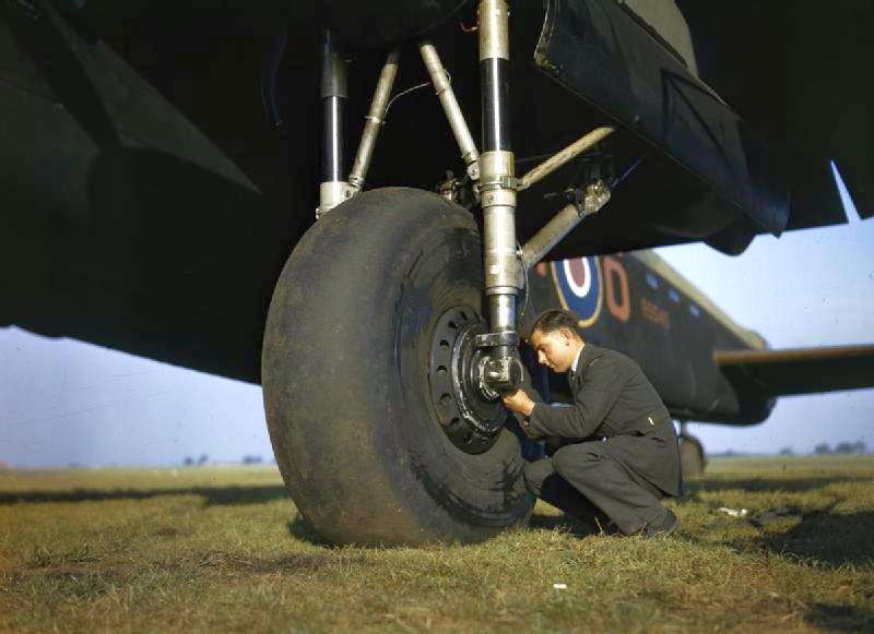 0Testing_the_tyre_pressure_of_Avro_Lancaster_R5540_of_No_44_Squadron_Conversion_Flight_at_Waddington,_Lincolnshire.jpg
