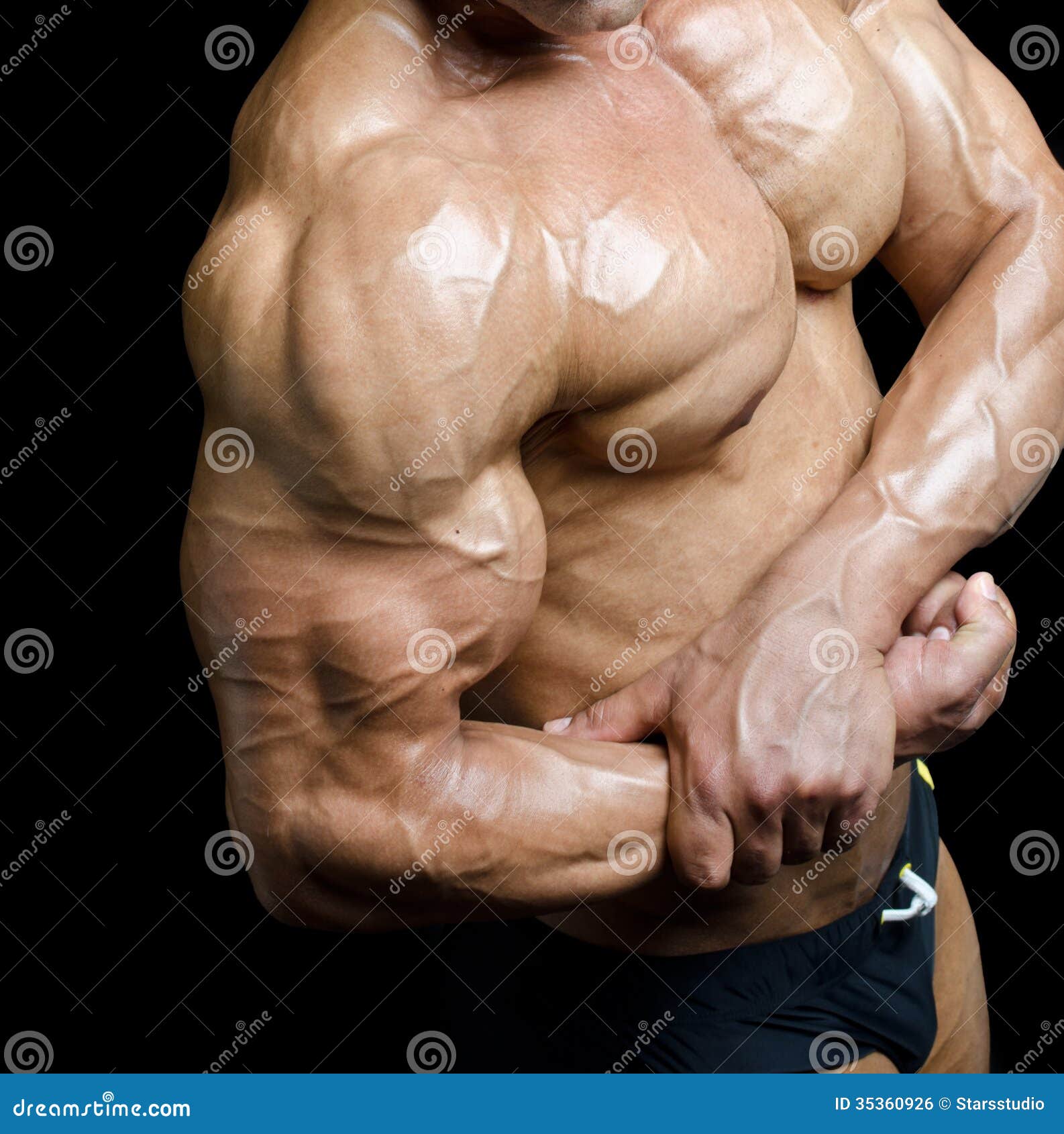 arm-torso-muscular-male-bodybuilder-flexing-biceps-detail-ripped-bicep-pecs-black-background-35360926.jpg