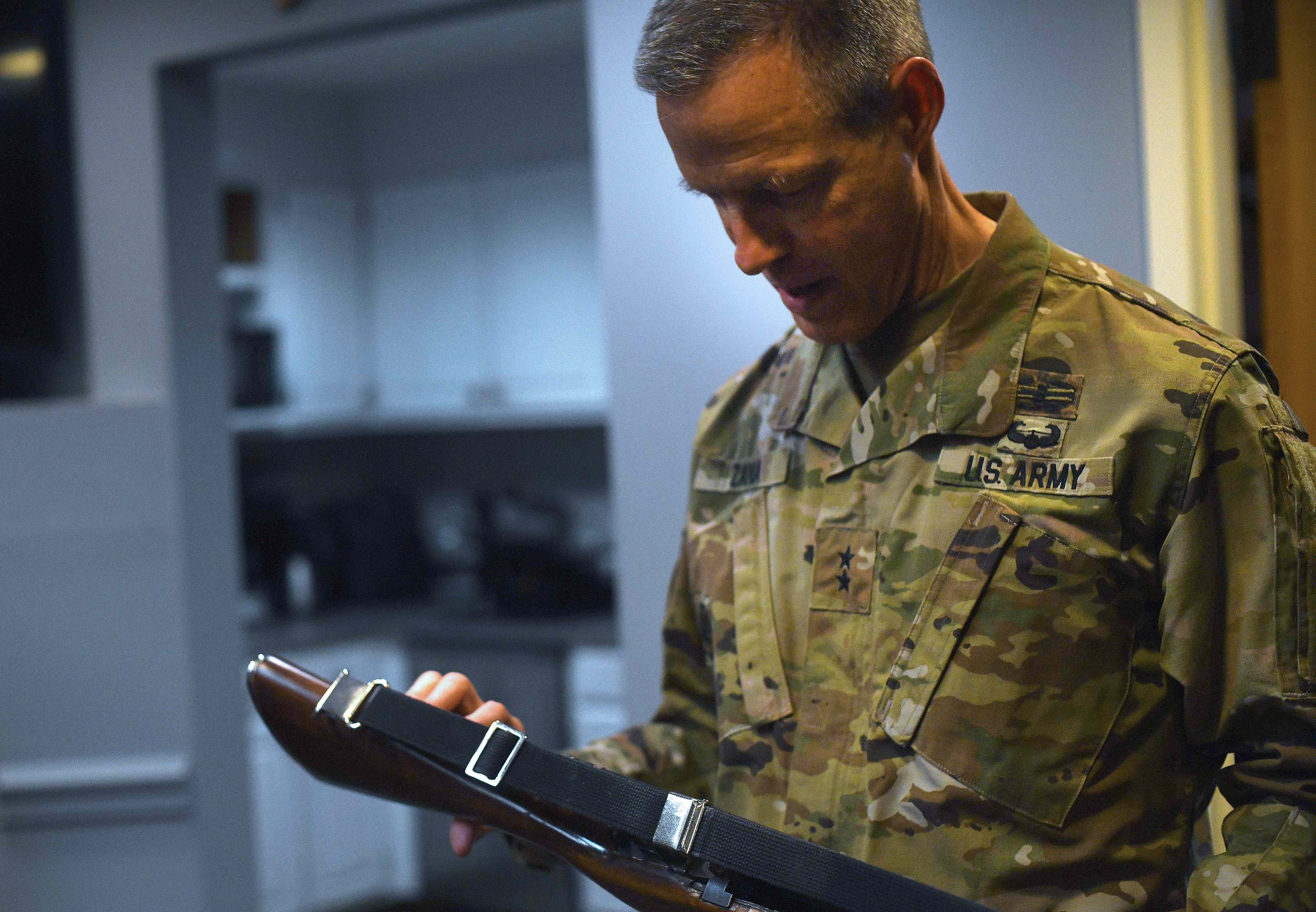 U.S. Army Maj. Gen. William Zana, director of international affairs with the National Guard Bureau, examines a ceremonial M14 rifle as he prepares to stand one final watch over the Tomb of the Unknown Soldier at Arlington National Cemetery, May 31, 2024. Zana, who served as a Tomb guard early in his career, stood watch over the Tomb as his final act in uniform. Just after completing his watch, at midnight, June 1, Zana would officially be retired from the Army. (U.S. Army photo by Sgt. 1st Class Jon Soucy)