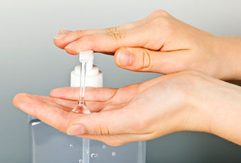 using hand sanitizer