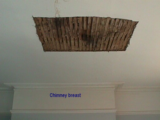 ceiling-plaster-damaged-by-roof-leak-removed-wooden-laths-exposed-during-repair-1-ANON.jpg