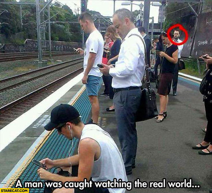 man-was-caught-watching-the-real-world-others-looking-at-their-phones.jpg