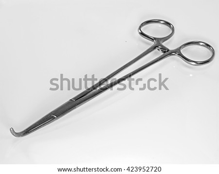 stock-photo-surgical-suture-forceps-in-stainless-steel-white-background-423952720.jpg