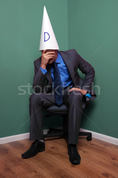 216137_stock-photo-businessman-wearing-a-dunce-hat.jpg