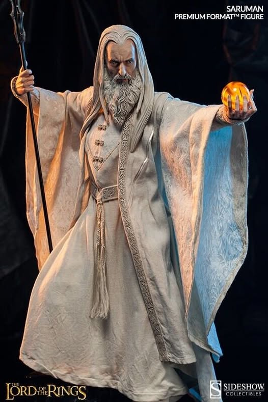 May be an image of 1 person, toy and text that says SARUMAN PREMIUMFORMATIMFGL RMATM FIGURE LORDRINGS LORD RINGS SIDESHOW COLLEC COLLECTIBLES BLES