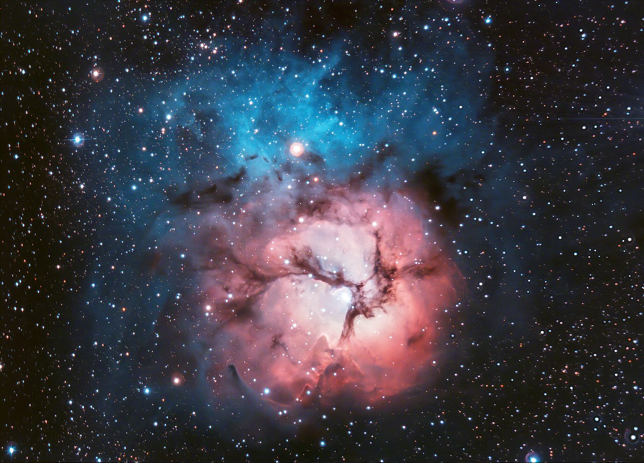1280px-Trifid_Nebula_by_Deddy_Dayag.jpg